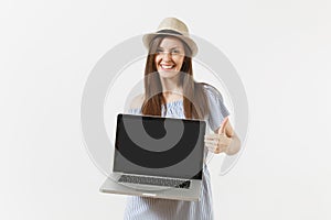 Young woman holding modern laptop pc computer with blank black empty screen to copy space isolated on white background