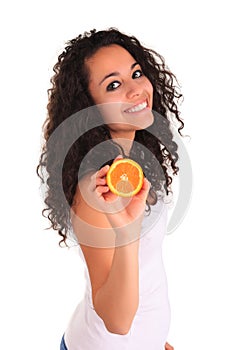 Young woman holding orange. Isolated over white