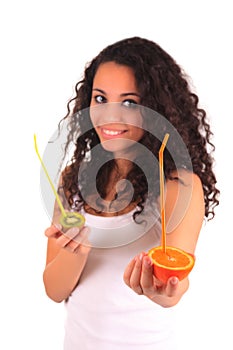 Young woman holding orange and kiwi. Isolated over white