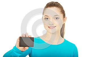 Young woman holding paper card.