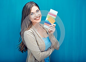 Young woman holding passport, credit card.