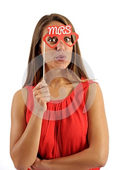 Young Woman Holding Photo Booth Prop