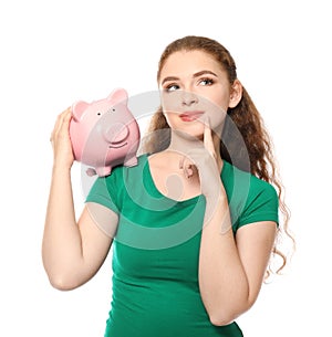 Young woman holding piggy bank on white background. Money savings concept