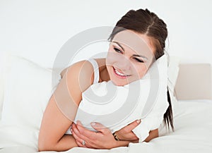 Young woman holding a pillow
