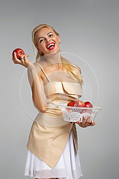 Young woman holding red apple