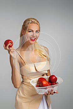 Young woman holding red apple