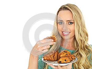 Young Woman Holding a Selection of Danish Pastries