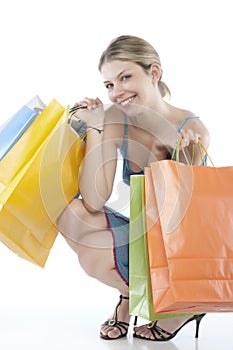 Young woman holding several shoppingbags. photo