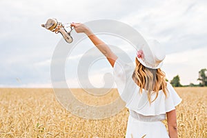 Young woman holding a shoe - sale, consumerism and people concept