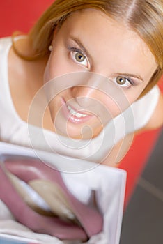 Young woman holding shoebox