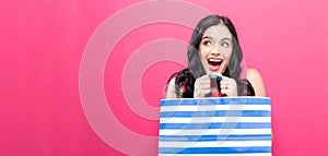 Young woman holding a shopping bag