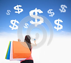 Young woman holding shopping bags and credit card