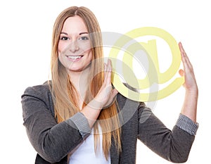 Young woman holding at sign