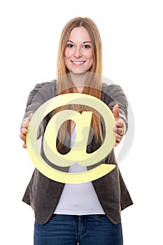 Young woman holding at sign