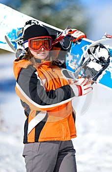 young woman holding a snowboard