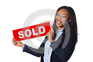 Young Woman Holding Sold Sign