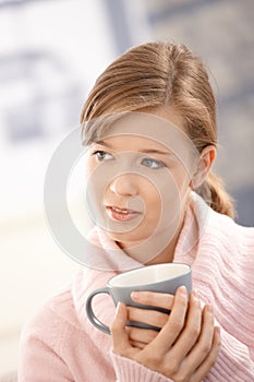 Young woman holding tea mug