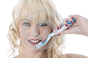 Young Woman Holding Tooth Brush Brushing Teeth