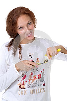 Young woman holding tooth brush and toothpaste
