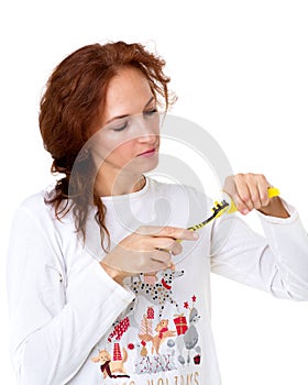 Young woman holding tooth brush and toothpaste