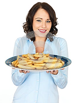 Young Woman Holding a Tray of Roast Parsnips