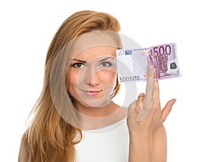 Young woman holding up cash money five hundred euro