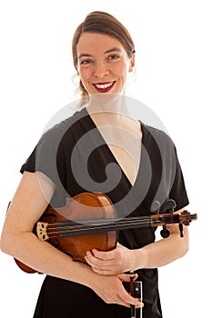 The young woman is holding a violin in her hand