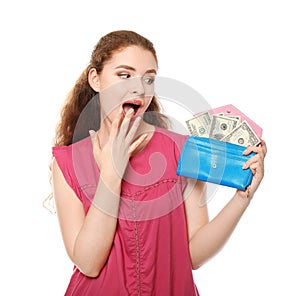 Young woman holding wallet with dollar banknotes on white background. Money savings concept