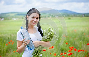 Young woman holding water bottle