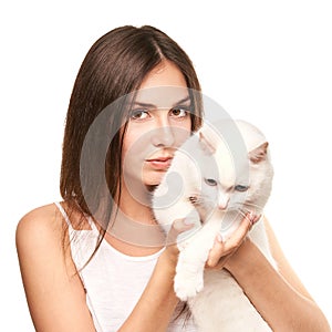 Young woman holding white cat. Allergy concept. Pretty human and pet
