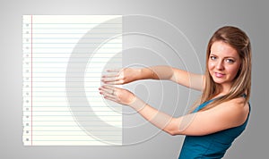 Young woman holding white paper copy space with diagonal lines