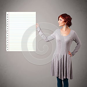 Young woman holding white paper copy space with diagonal lines