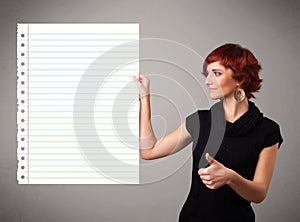 Young woman holding white paper copy space with diagonal lines