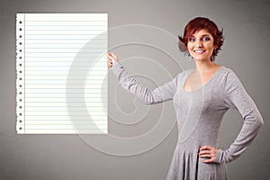Young woman holding white paper copy space with diagonal lines