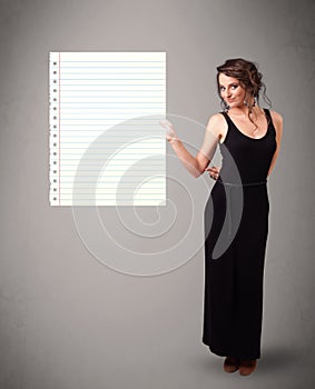 Young woman holding white paper copy space with diagonal lines