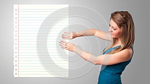 Young woman holding white paper copy space with diagonal lines