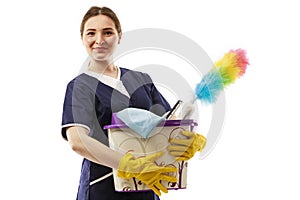 Young woman holds basin with washing fluids and rags in hands