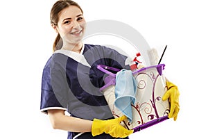 Young woman holds basin with washing fluids and rags in hands