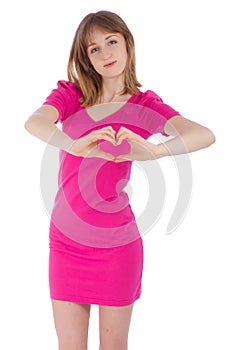 The young woman holds hands in the form of heart