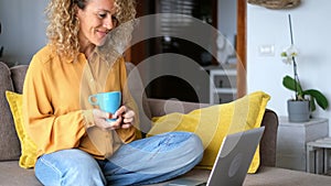 Young woman at home with laptop computer and connection - smart working free office home activity - modern people online job remot