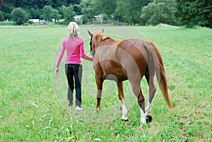 Young woman with horse