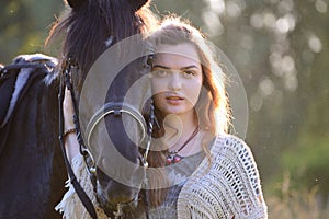 Young woman with horse