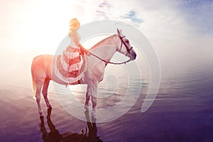 Young woman on a horse. Horseback rider, woman riding horse on b