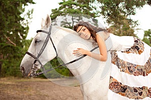 Young woman on a horse. Horseback rider, woman riding horse