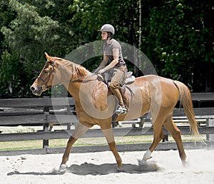 Young woman horseback riding