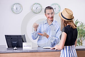 Young woman at hotel reception