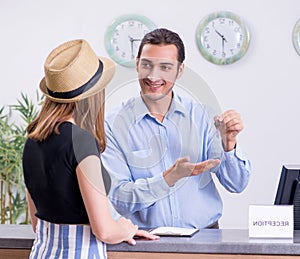 Young woman at hotel reception