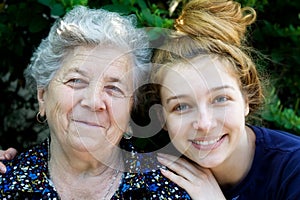 Young woman hugging her grandmother