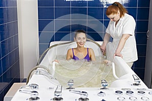 Young woman during hydromassage