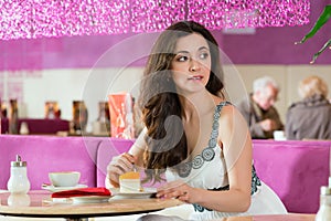 Young woman in ice cream parlor